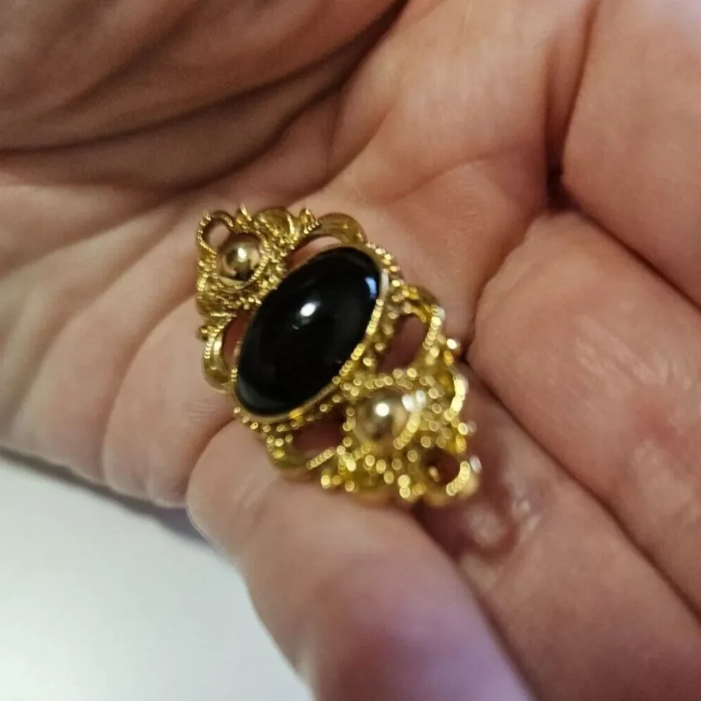 1928 brand gold tone with black brooch